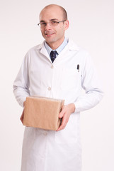 Man in lab coat holding a box