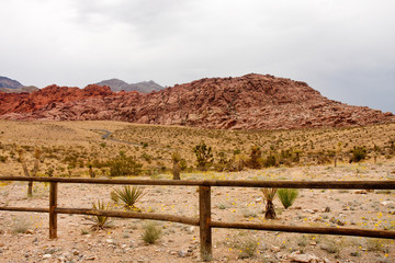 Wood Rail Fence Across Desert by Mountains