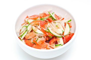 healthy salad made of cucumbers, tomatoes and onions.