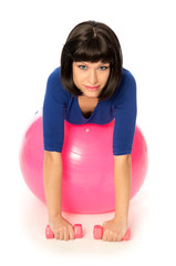 Fototapeta premium Exercises with dumbbells on a gymnastic ball