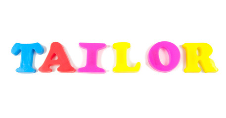 tailor written in fridge magnets on white background