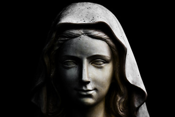 Holy Mary statue isolated on black © Minerva Studio