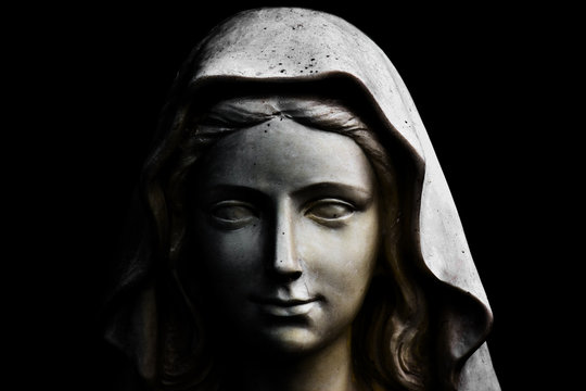 Holy Mary statue isolated on black