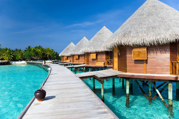 Maldives. A wooden road over ocean..