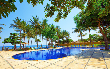 Pool, ocean, palm trees.Indonesia. Bali.