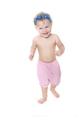 studio portrait of happy child in swim glasses over white