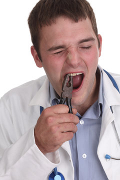 Self dentistry, young man pulling own teeth