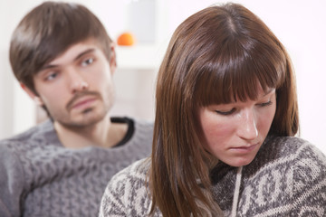 sad couple at home