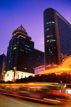 Nightscape downtown fuzhou with blurred bus trailing