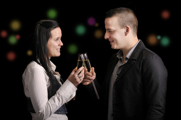 Happy young couple having a drink
