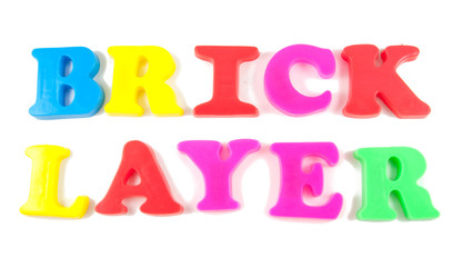 brick layer written in fridge magnets on white background