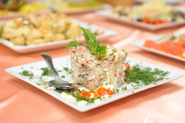 russian salad on white square plate
