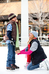 A mother and her son ice-skating