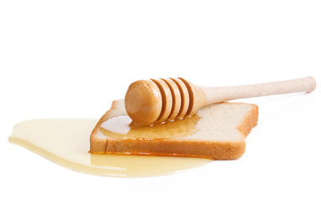 honey and bread isolated on white