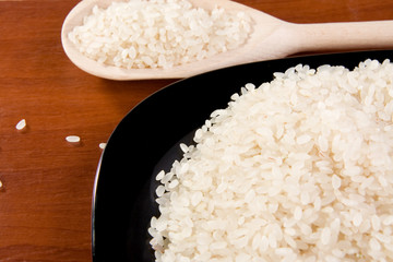 rice and plate with spoon on table
