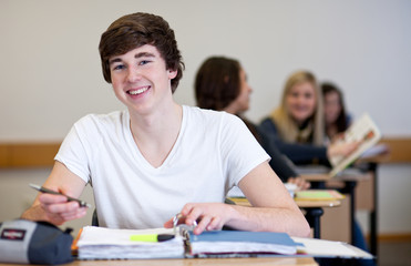 Student working on homework in classroom