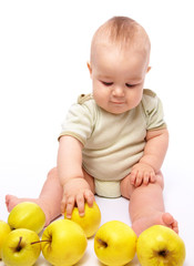 Little boy play with apples