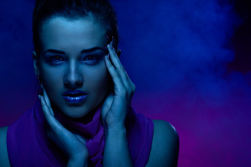 Portrait of the beautiful girl in dark tones