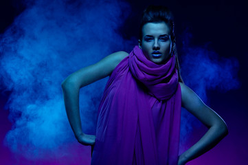 Portrait of the beautiful girl in dark tones