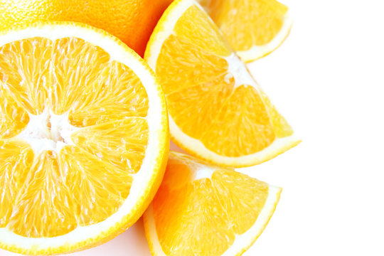 Sliced oranges on a white background
