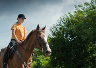 Obraz premium girl riding a horse