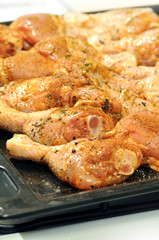 Chicken drumstick with spices ready for baking