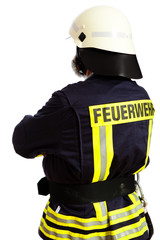 Feuerwehrmann, mit dem Rücken zur Kamera stehend