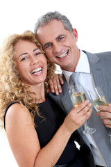 Couple celebrating new year's eve with champagne