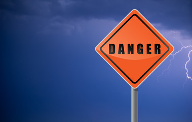 Traffic sign danger clouds lightning.