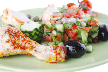 grilled chicken meat drumstick served green