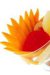 Obraz na płótnie Canvas fruits within transparent cup