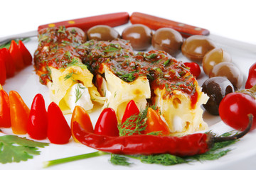 cheese cannelloni served with pepper and tomato
