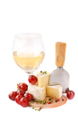 The French cheese, grapes and glass of white dry wine