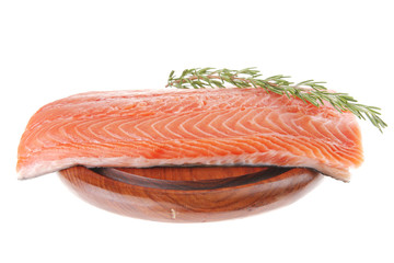 raw salmon fillet on wood and rosemary