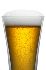 Beer into glass isolated on white