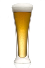 Beer into glass isolated on white