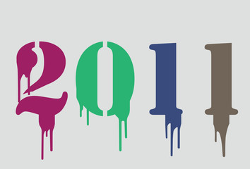 2011 with colorful drops and sprays on a black background