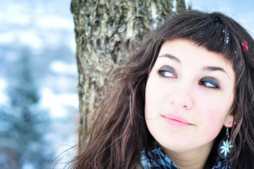 smiling young woman outdoors in winter time