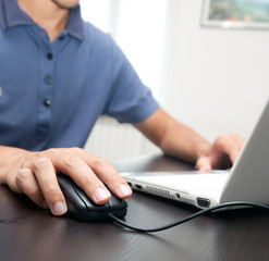 Man typing on the laptop
