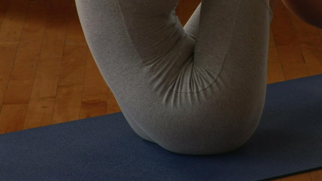 Young woman doing sit ups