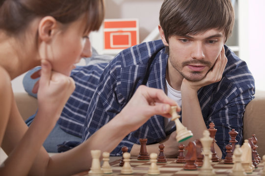 Couple Playing Chess Game