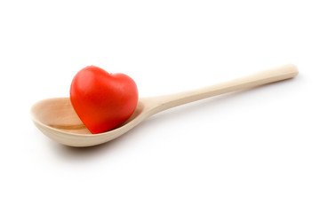Spoon and heart isolated on white