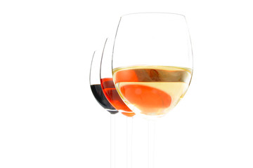 three wine glasses of white and red vine
