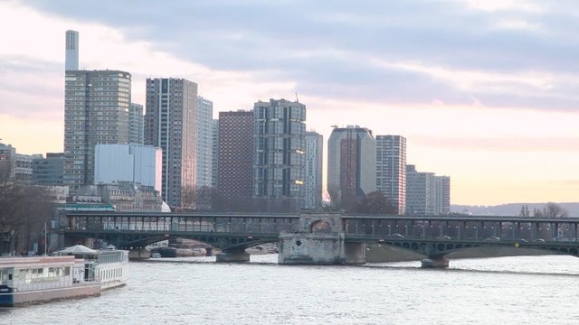 Siene river, bridge and skyscrapers in Paris, France