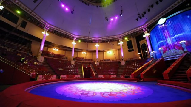 panning of interior of circus with empty arena