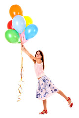 Fototapeta na wymiar little girl holding a bunch of happy flying balls on white backg