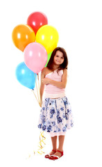Fototapeta na wymiar little girl holding a bunch of happy flying balls on white backg