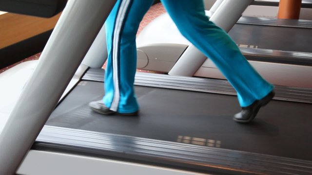 legs of woman going in gym