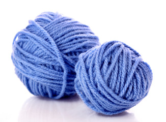 Blue balls of woollen thread isolated on white
