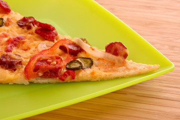 Tasty Italian pizza on green plate